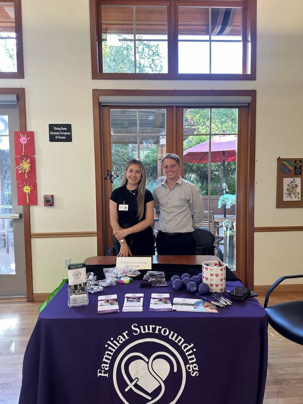 Familiar Surroundings Home Care staff at a community event table