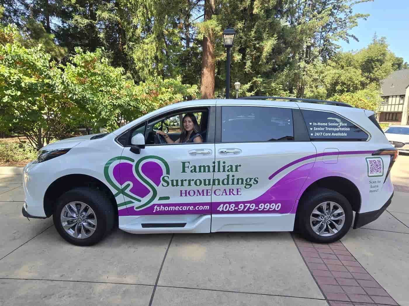 Familiar Surroundings Home Care team member in the branded senior transportation van