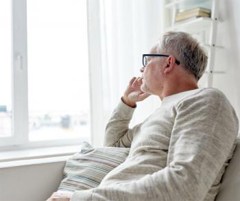 Senior looking out the window